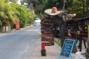 a mexican sombrero and a look down tulum beach road going south