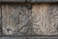 This is a carving on the wall of the jaguars and serpents platform depicting both eagles and jaguars clutching a human heart indicating that human sacrifices may have been made here