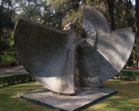This sculpture is called "Serie Instrumento de Viento" which translates to wind instrumet series